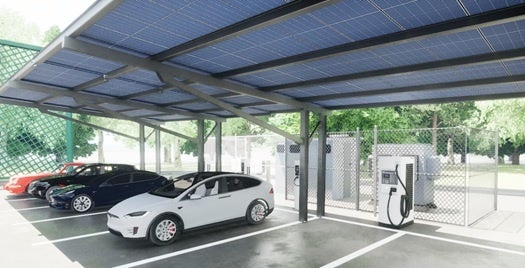 屋根に太陽光パネルを並べたカーポートの下に電気自動車が並び、手前にEV急速充電器が立つ完成イメージ
